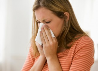 Woman Blowing Her Nose - Woman With a Cold - Beating Seasonal Illness