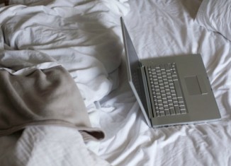 Daily Bite Wellness Tip - Don't Work In Bed - Featured Image