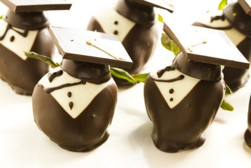 Gourmet chocolate covered strawberries decorated for graduation party.