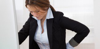 Businesswoman With Back Pain